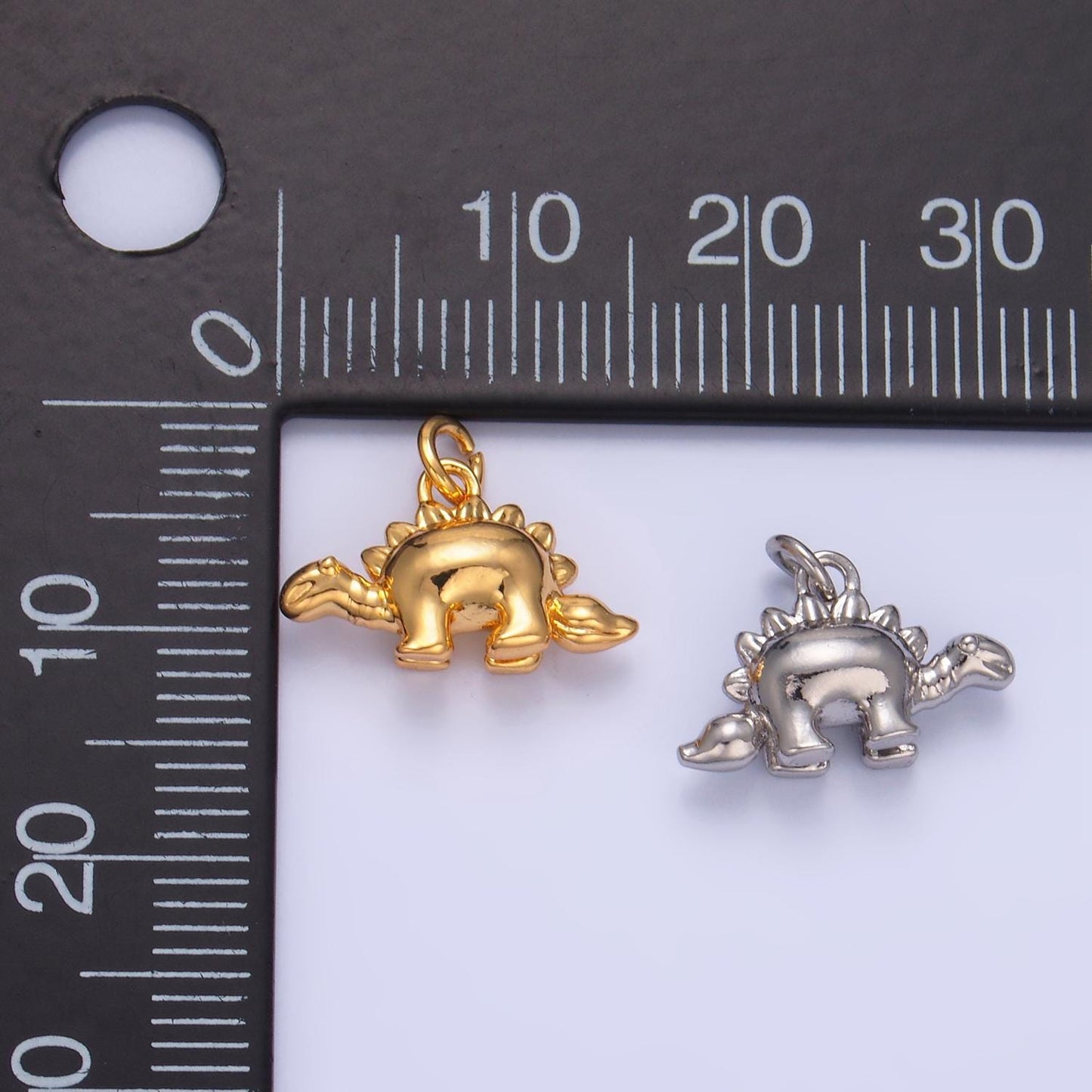 Mini Stegosaurus Charm Gold dinosaur pendant Jurassic animal extinct prehistoric charm. small jewelry. paleontologist W139