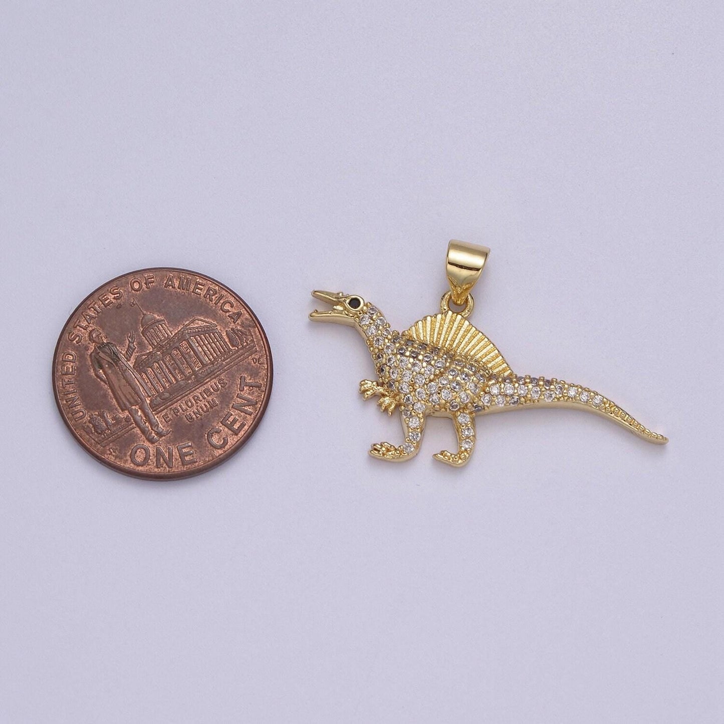 Dinosaur pendants in gold, spinosaurus charm dino jewelry in clear cubic zirconia j-334
