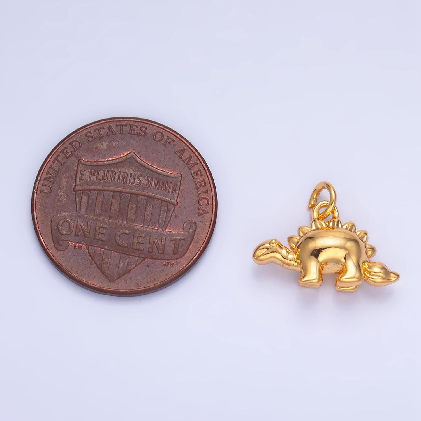Mini Stegosaurus Charm Gold dinosaur pendant Jurassic animal extinct prehistoric charm. small jewelry. paleontologist W139