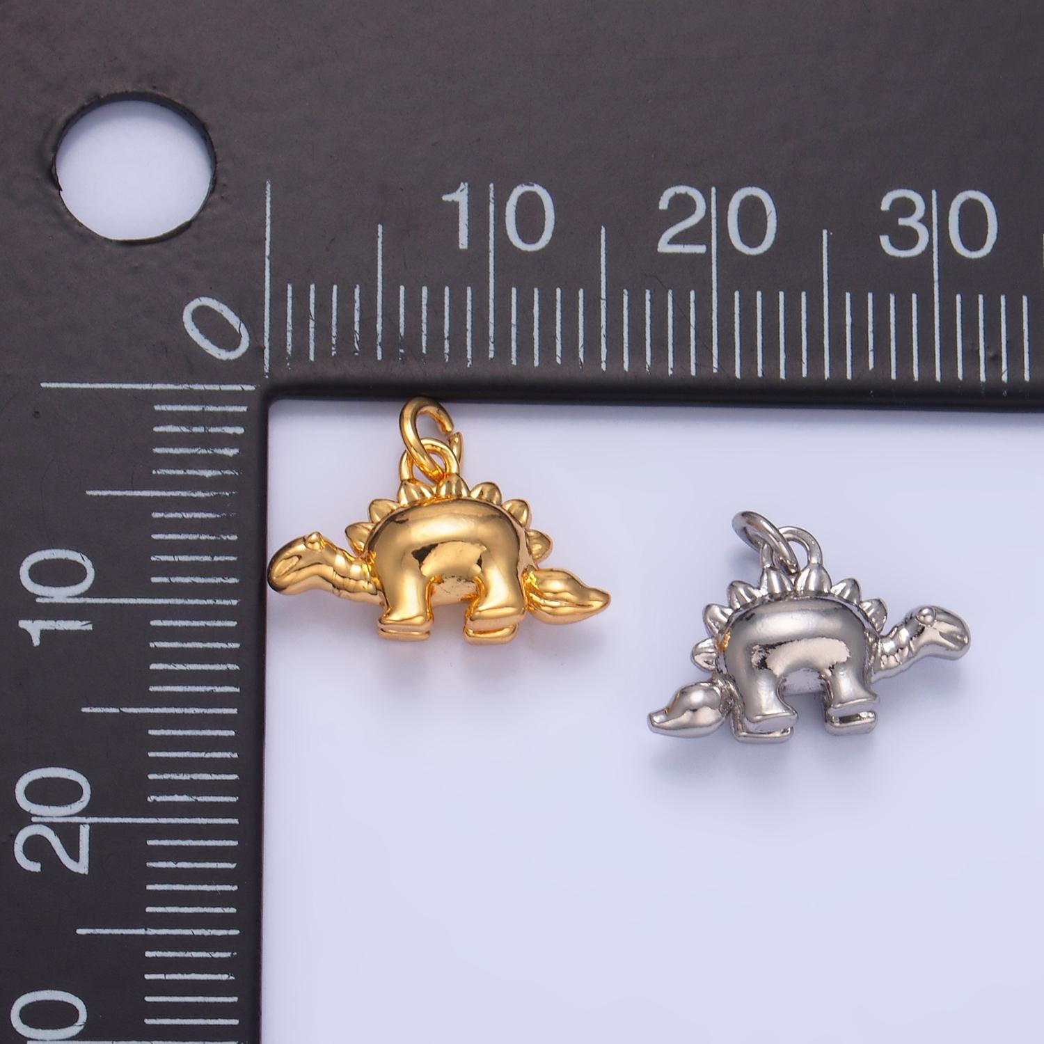 Mini Stegosaurus Charm Gold dinosaur pendant Jurassic animal extinct prehistoric charm. small jewelry. paleontologist W139
