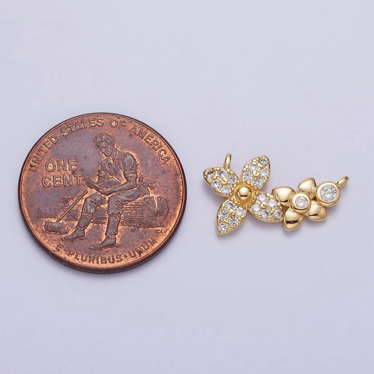 Gold micro paved round cubic zirconia flower link connector | f785