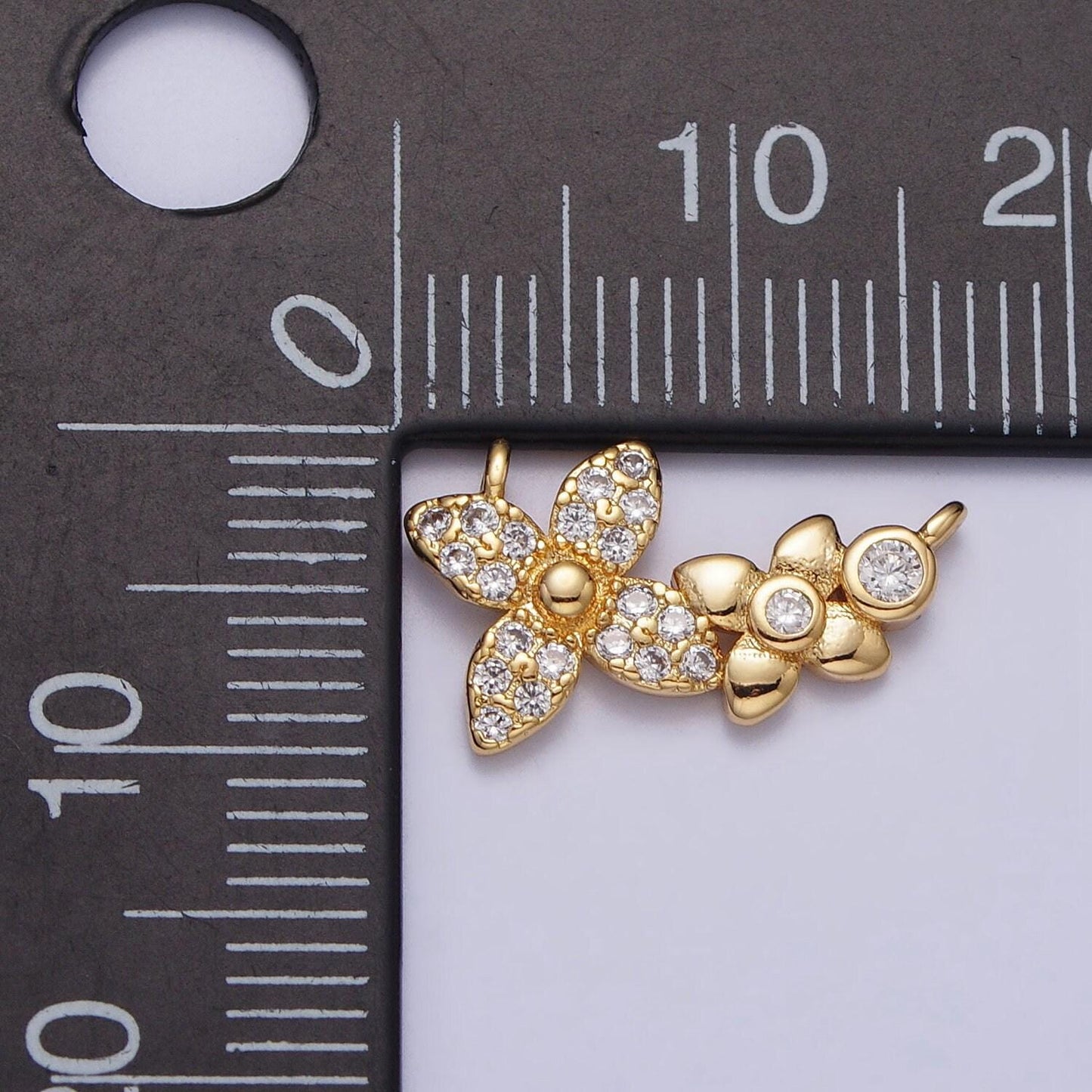Gold micro paved round cubic zirconia flower link connector | f785
