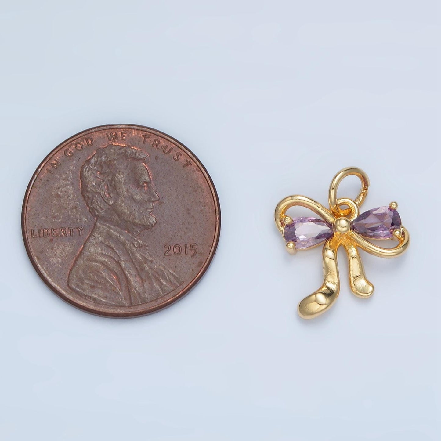 Clear, purple, peach and pink cz double loop mini ribbon bow gold filled charm | x-563