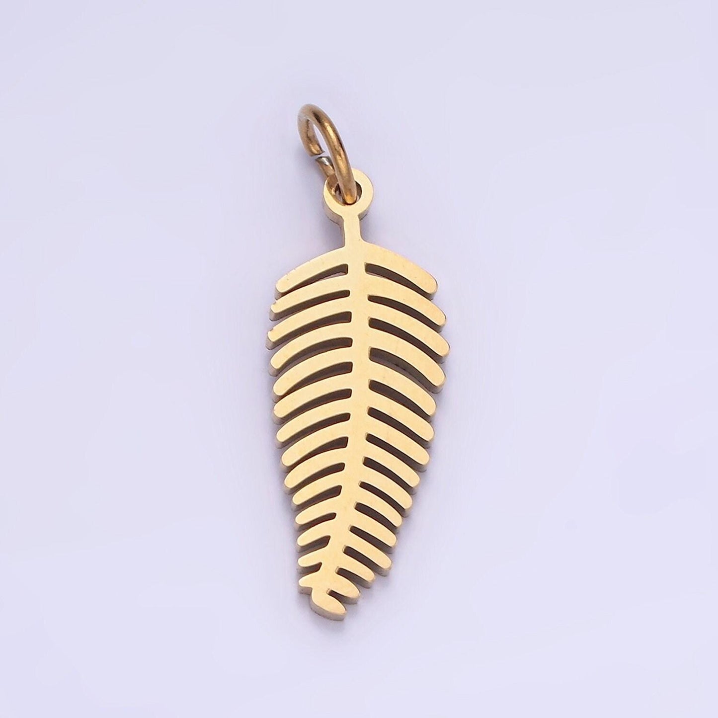 Dainty gold palm tree leaf charm in stainless steel p-1400