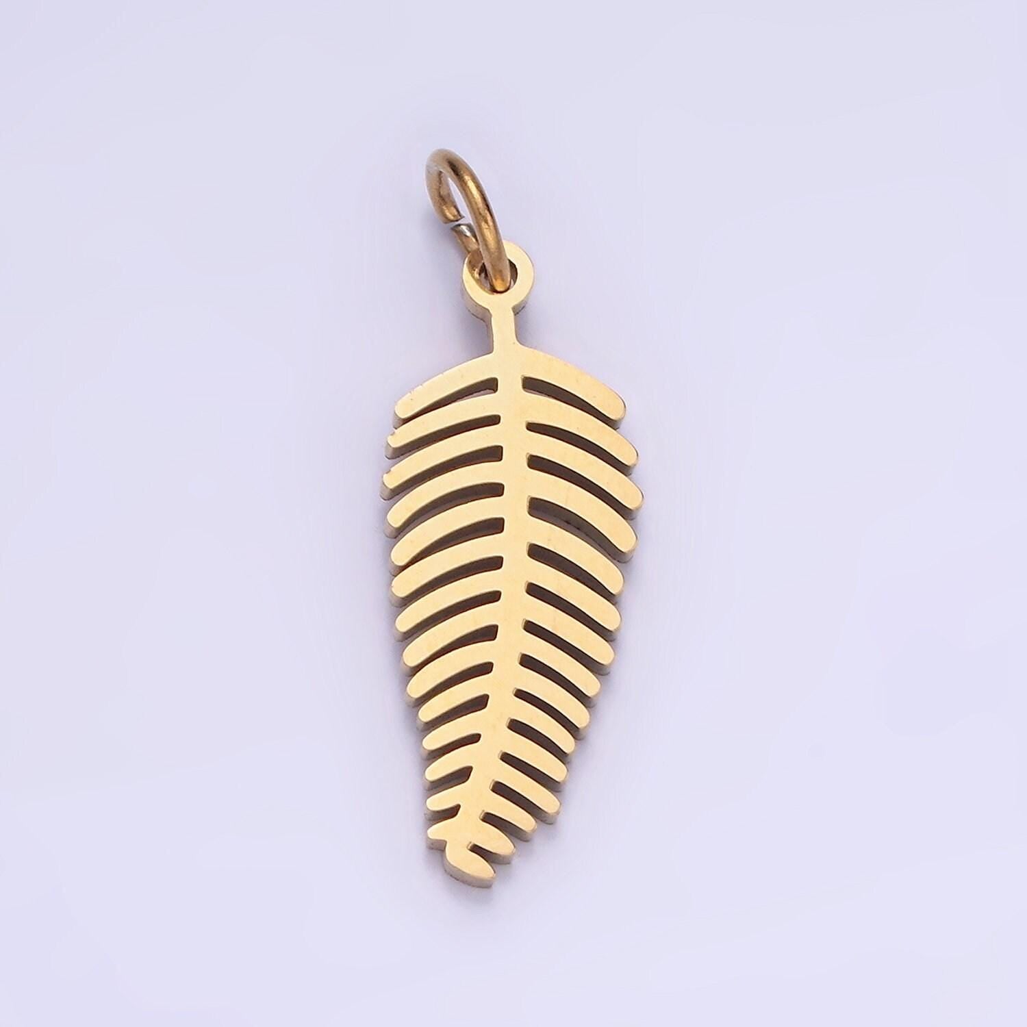 Dainty gold palm tree leaf charm in stainless steel p-1400