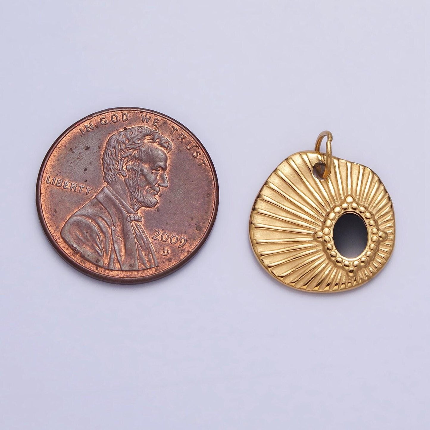 Stainless steel black oval abstract sunburst charm in gold & silver | p-1228 ab1117