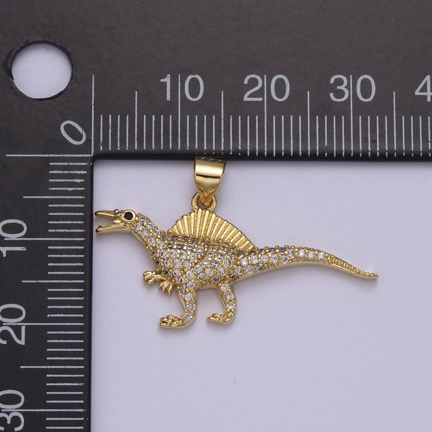 Dinosaur pendants in gold, spinosaurus charm dino jewelry in clear cubic zirconia j-334