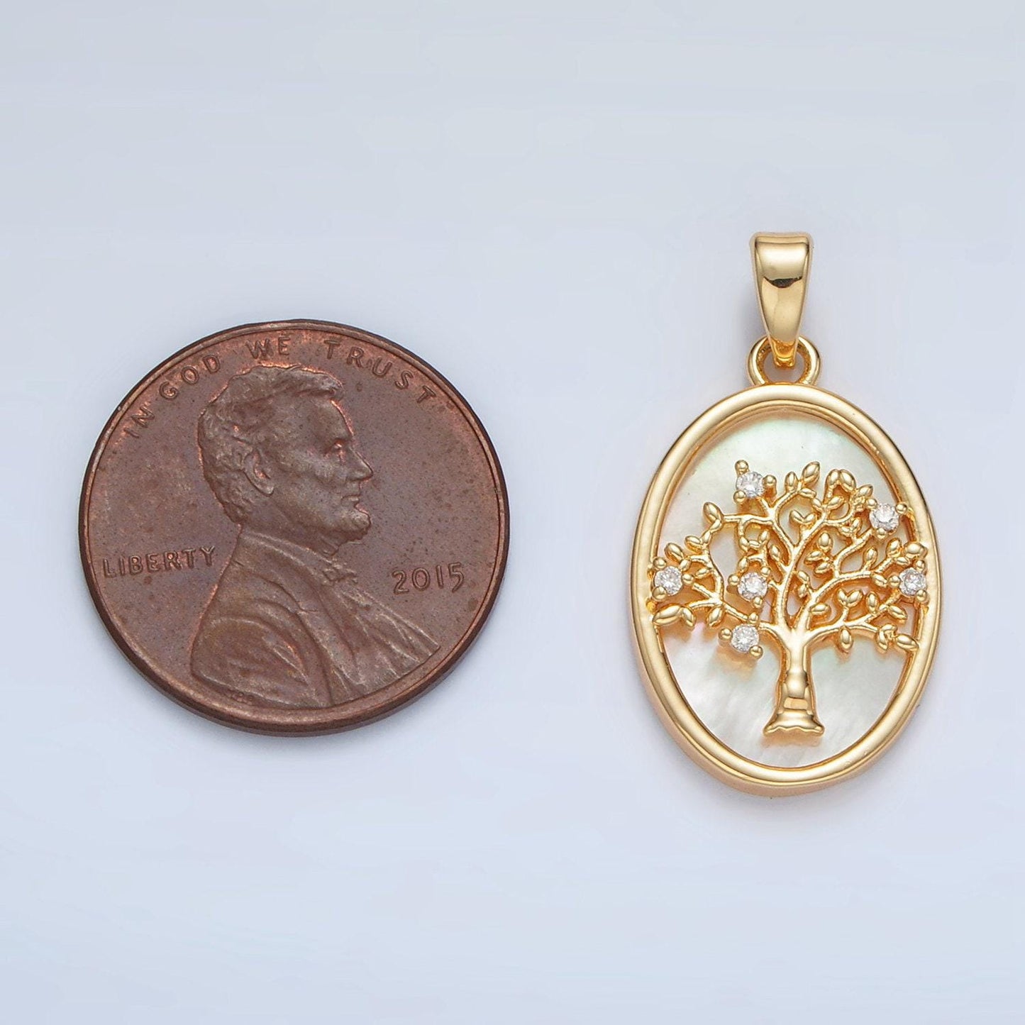 Gold filled shell pearl oval pendant with a cz tree design in gold & silver | aa1525