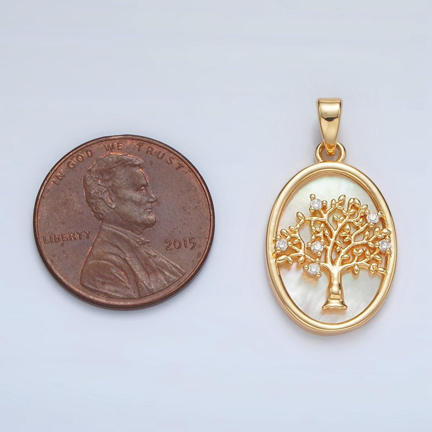 Gold filled shell pearl oval pendant with a cz tree design in gold & silver | aa1525