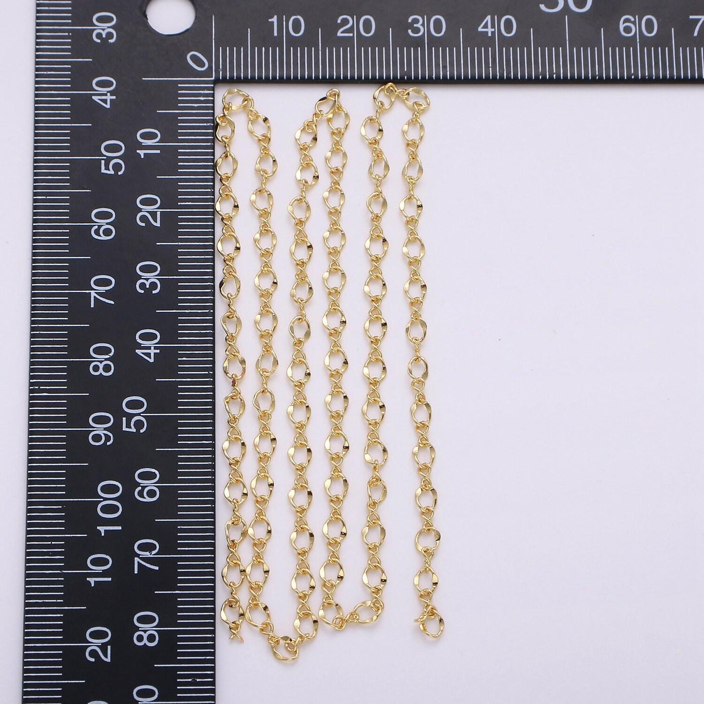 Gold pounded oval chain by yard, figure 8 link chain, twisted wholesale bulk roll chain for bracelet, necklace, anklet jewelry making,137