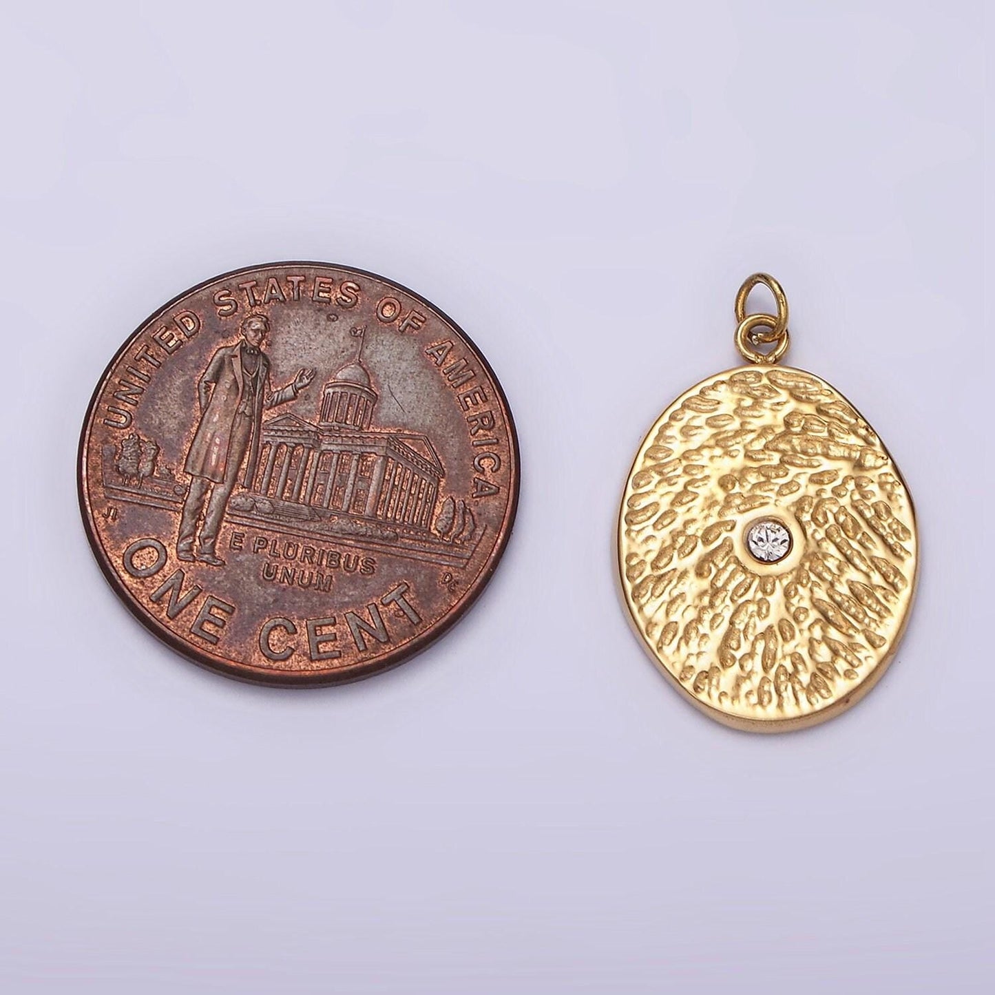 Stainless steel clear cz dented oval charm in gold & silver | p1310