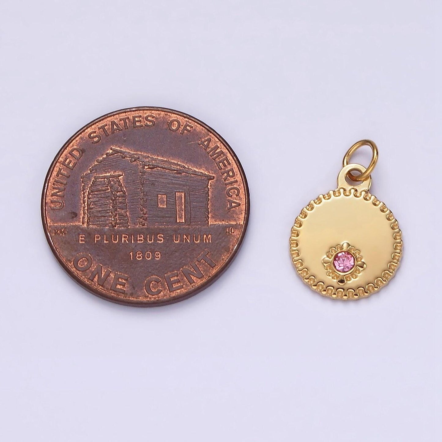 Stainless steel pink cz dotted stamped outline round charm | p632