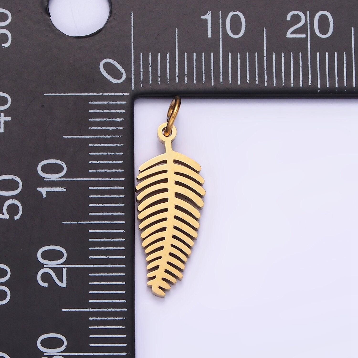 Dainty gold palm tree leaf charm in stainless steel p-1400