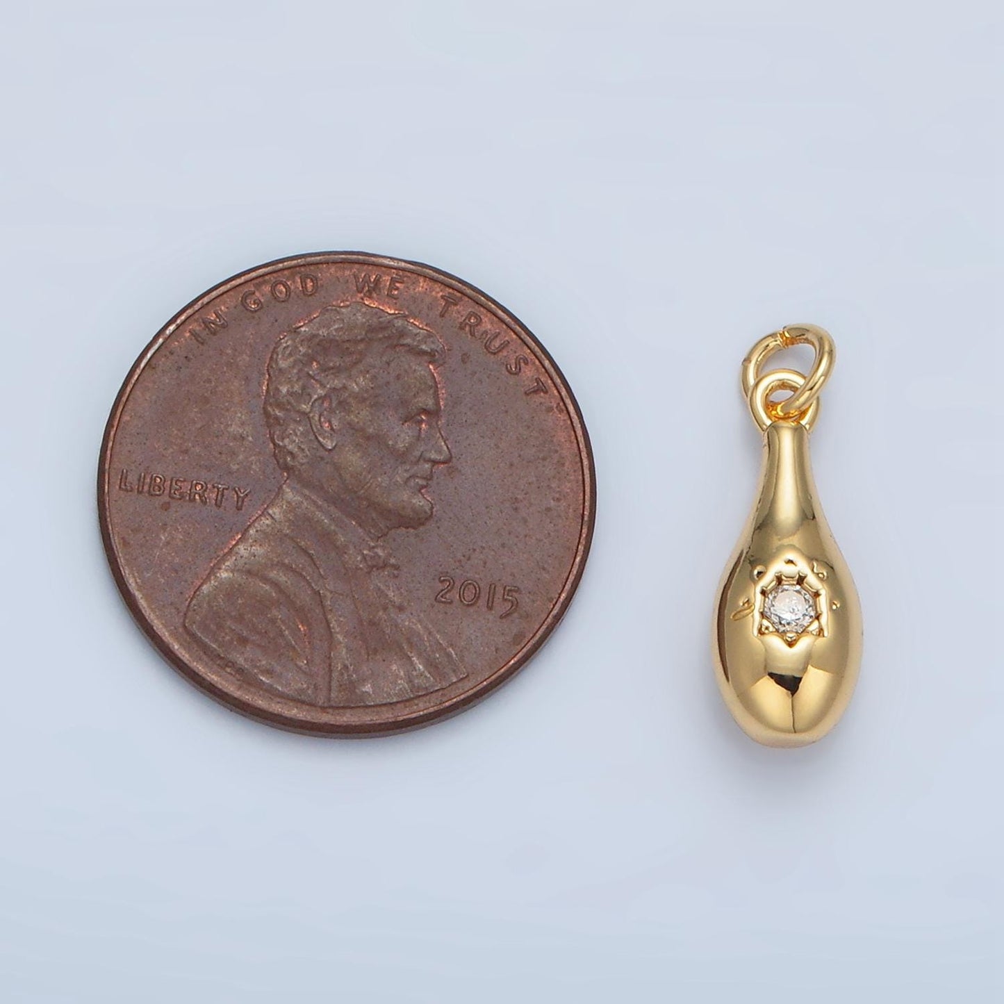 24k gold filled teardrop center cz paved charm in gold & silver | e-394